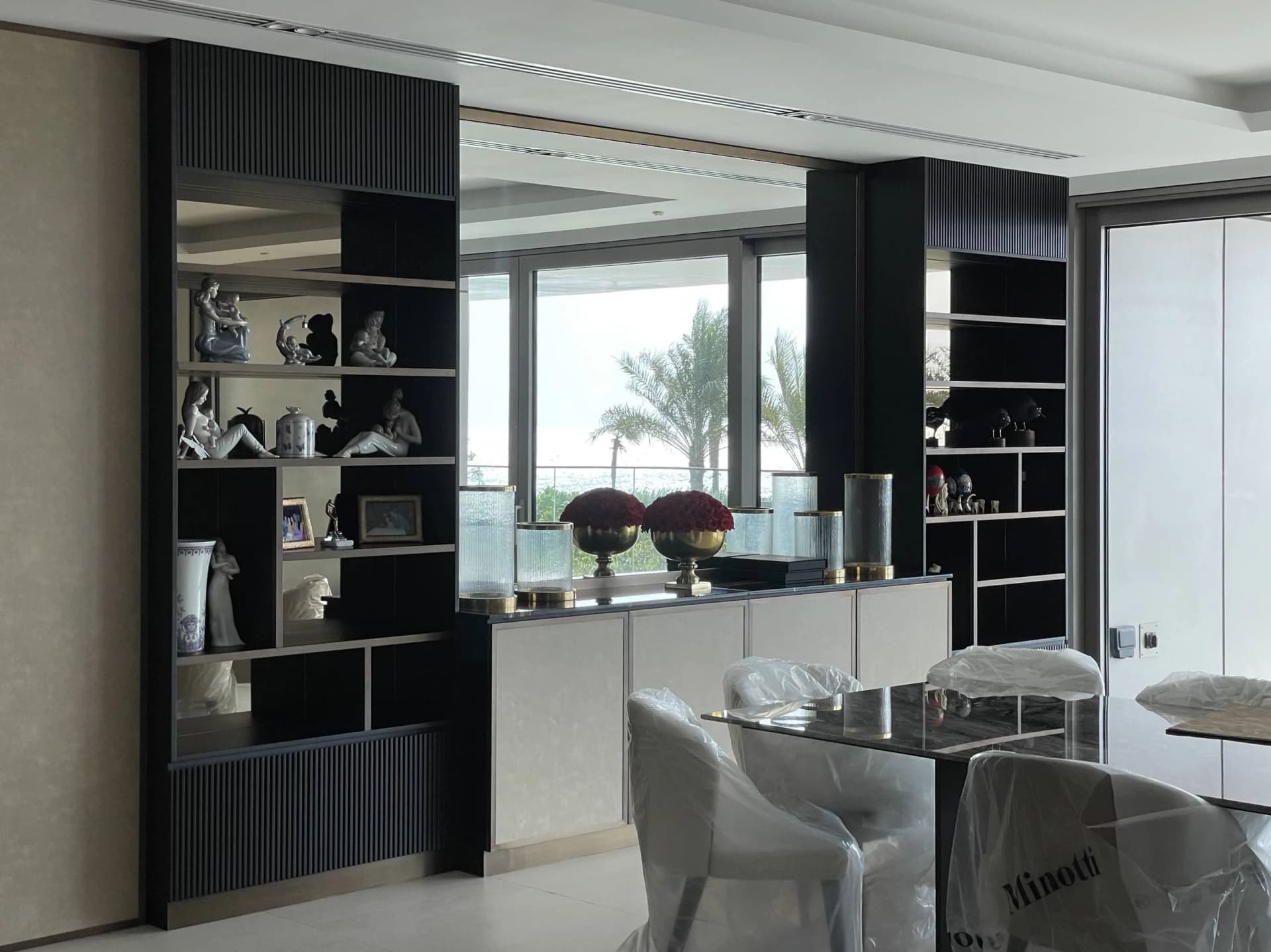 Luxury villa interior with white marble flooring and gold accents
