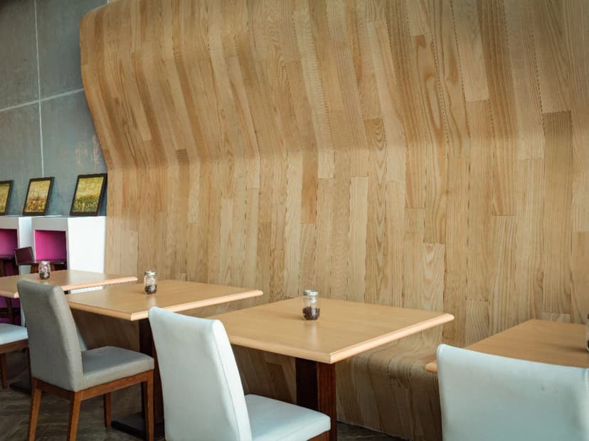 Private lounge with artistic wall décor and leather seating