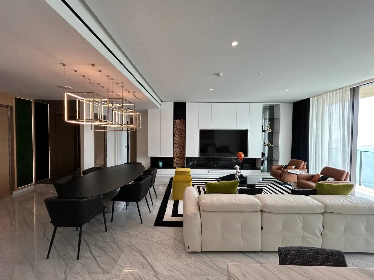 Luxury villa interior with white marble flooring and gold accents