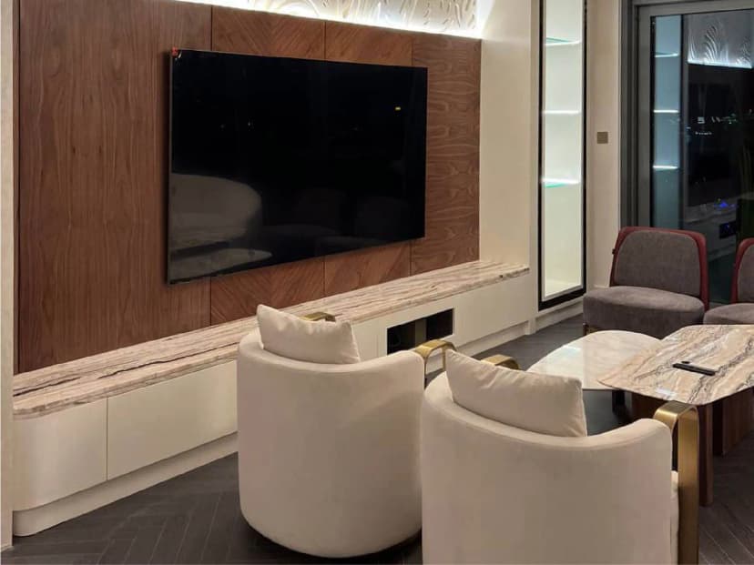 Bedroom with neutral tones and wall paneling