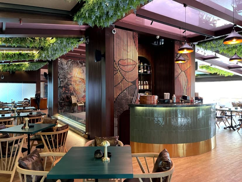 Private lounge with artistic wall décor and leather seating