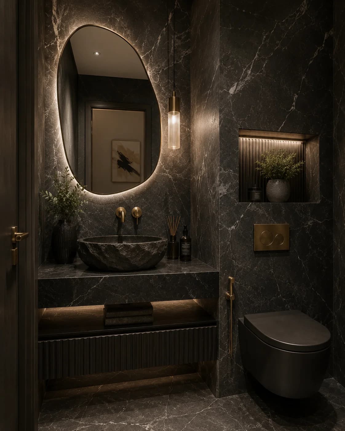 Sophisticated Dubai villa powder room featuring dramatic stone, sculptural basin and warm brass detailing.
