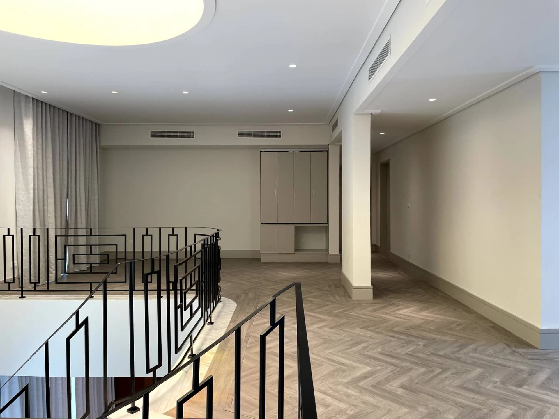 Luxury villa interior with white marble flooring and gold accents