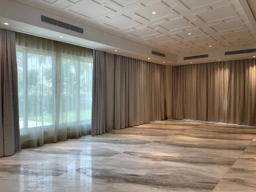 Bedroom with neutral tones and wall paneling