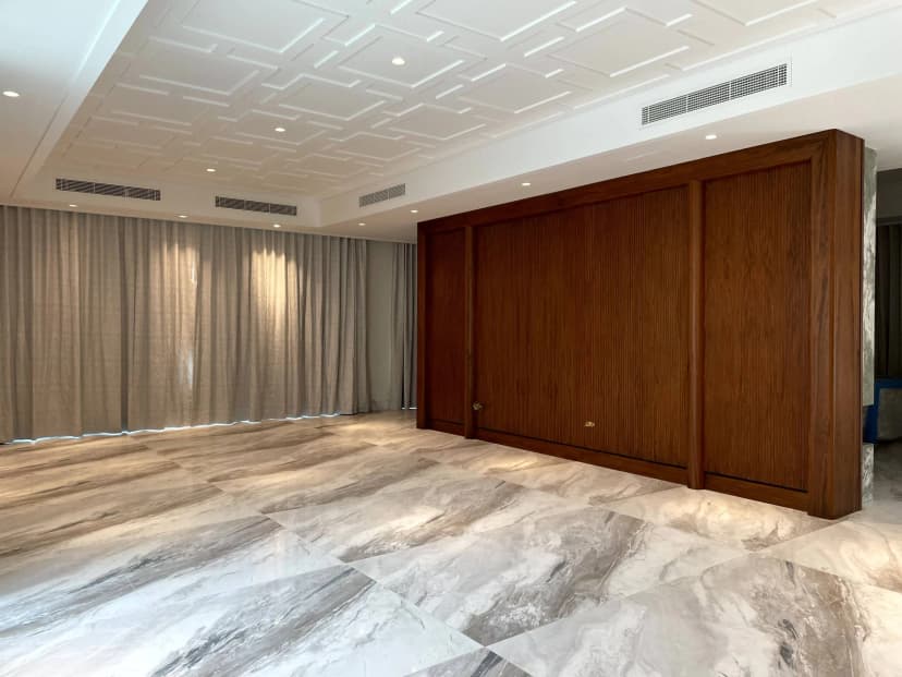 Bedroom with neutral tones and wall paneling