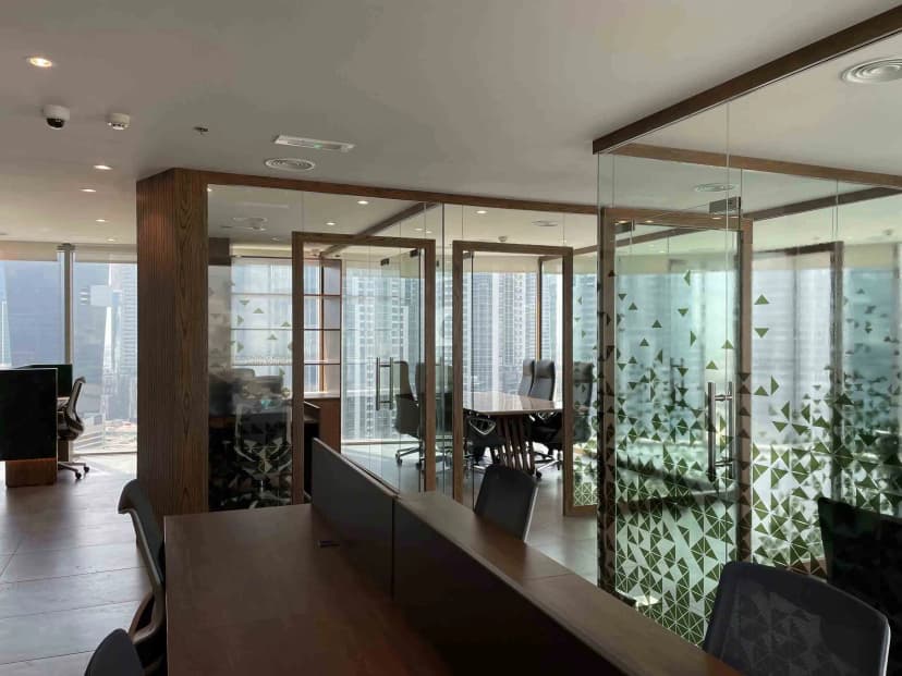 Private lounge with artistic wall décor and leather seating