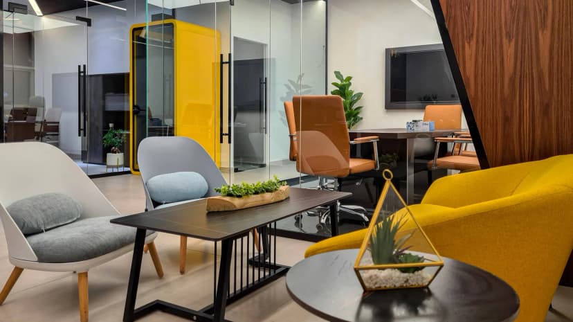 Private lounge with artistic wall décor and leather seating