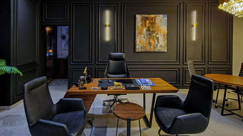 Private lounge with artistic wall décor and leather seating