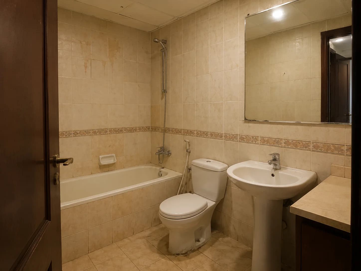 Dated Dubai apartment bathroom showing signs that renovation is needed