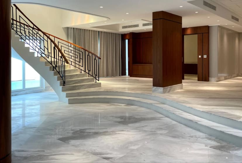 Villa staircase with chandelier and marble steps