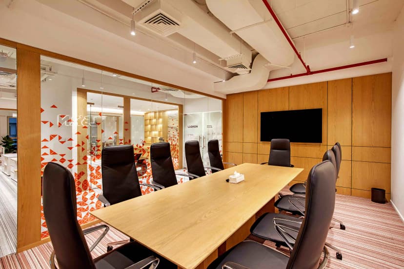 Private lounge with artistic wall décor and leather seating